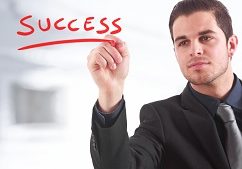 Businessman writing &quot;success&quot; on the screen